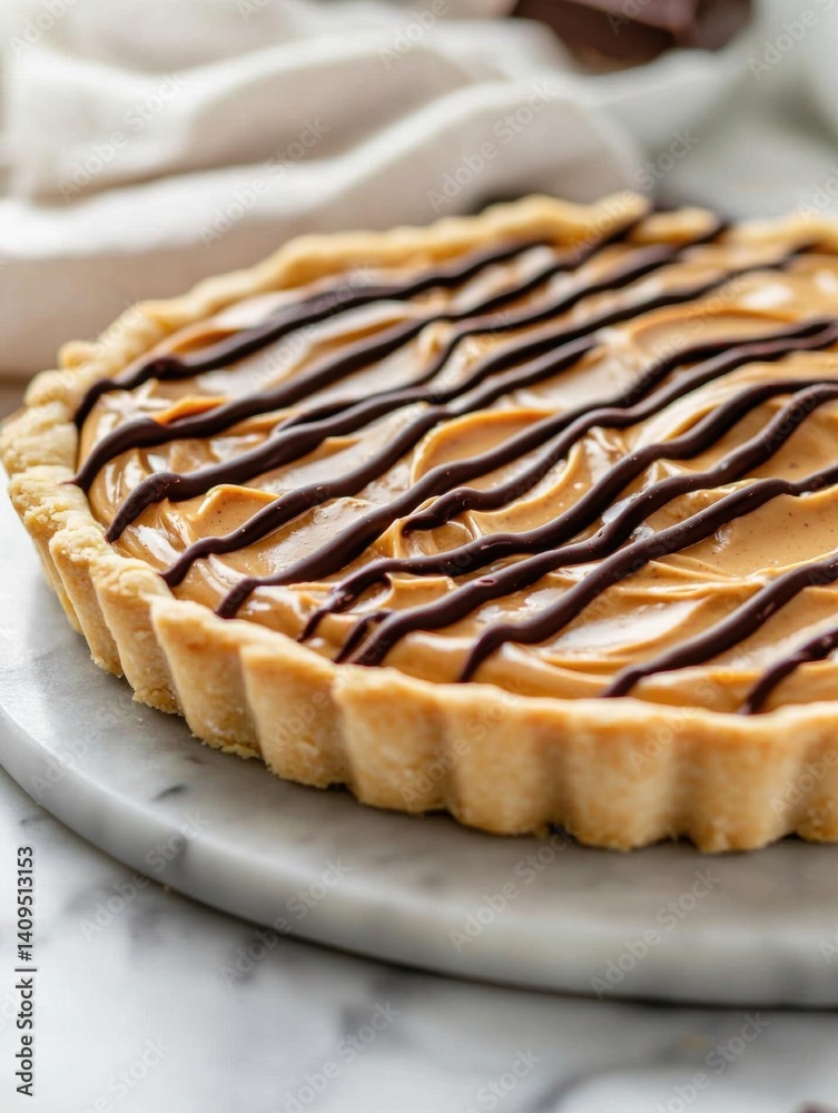 The image is of a freshly baked caramel tart on a white marble plate. the tart has a golden brown crust and is topped with a layer of caramel sauce. The image is of a freshly baked caramel tart on a white marble plate. the tart has a golden brown crust and is topped with a layer of caramel sauce.