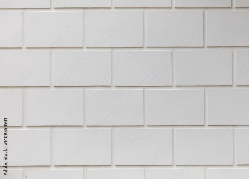 Fototapeta premium A white brick wall with a white brick pattern