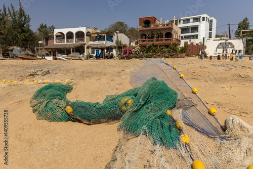 Fishing nets on the beach in Popenguine coastal town in Senegal photo