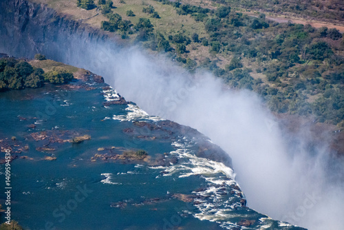 Obraz na płótnie Telephoto of the immense Victoria falls, as seen from the air. w salonie