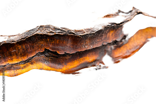 Fiery orange and brown abstract texture resembling a sunburnt landscape or ancient relic evoking feelings of warmth and age