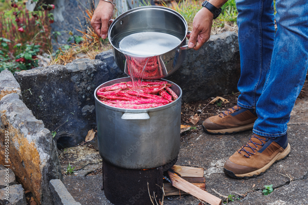 A pot of Cranberry bean cooked on a fire in Camacha mountainous town in municipality of Santa Cruz, Madeira Island, Portugal A pot of Cranberry bean cooked on a fire in Camacha mountainous town in municipality of Santa Cruz, Madeira Island, Portugal