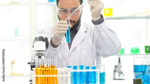 Research, experiment and medical trial being done by a scientist in a lab, science facility or hospital. One young, serious and professional researcher organizing, sorting or making a discovery