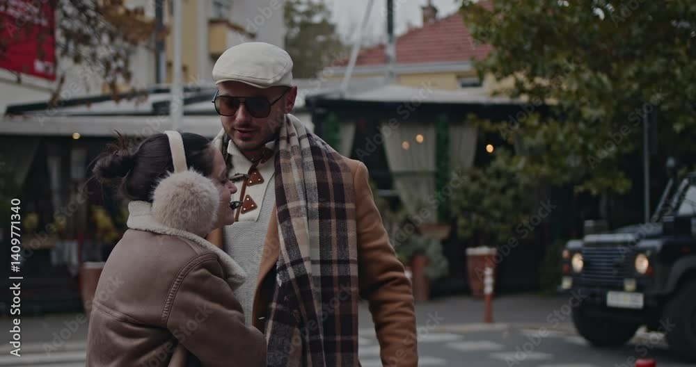 A loving couple enjoys a leisurely stroll through the city on a crisp autumn day, sharing warm moments and laughter. A loving couple enjoys a leisurely stroll through the city on a crisp autumn day, sharing warm moments and laughter.
