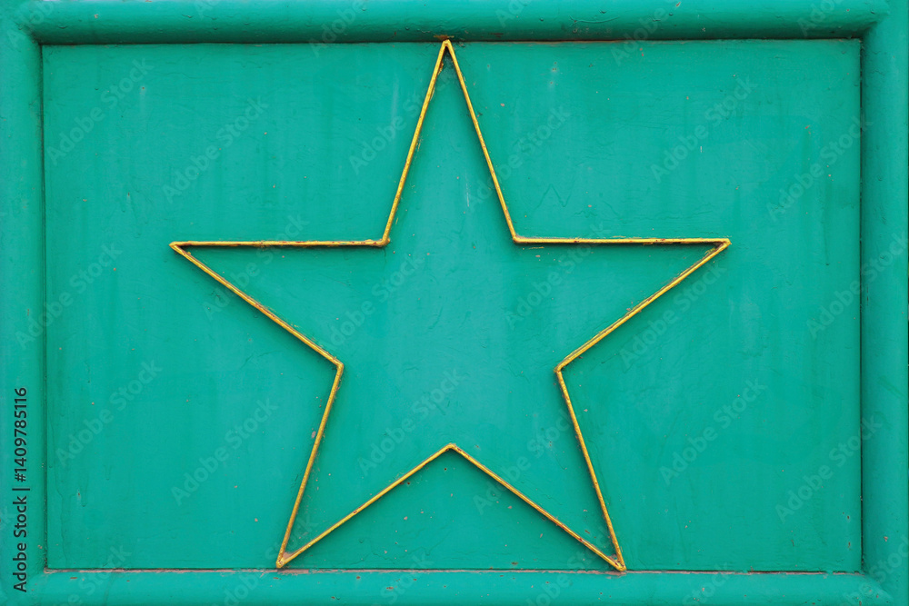 Fototapeta premium A richly textured background texture with vintage green tones and weathered golden star stylish and evocative of a bygone era.