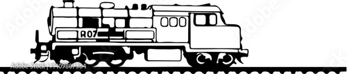 A train engine standing on a railroad track