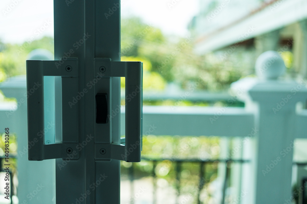 Close up of aluminum glass door handle with lock Close up of aluminum glass door handle with lock