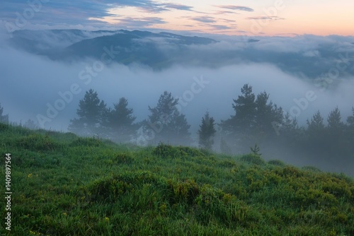 Mountain landscape with fog after rain, peaks in the fog. Beautiful, colorful spring panorama of Pieniny Mountains and Tatra Mountains in the fog and morning light, Poland, Slovakia photo