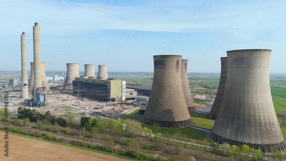Aerial drone power station plant cooling towers smoke stacks energy generation coal powered gas fuel renewables green energy England 