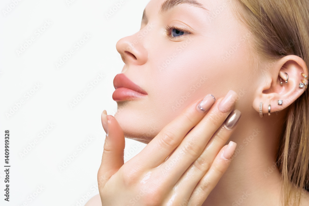 Woman applies a cleansing product to the skin