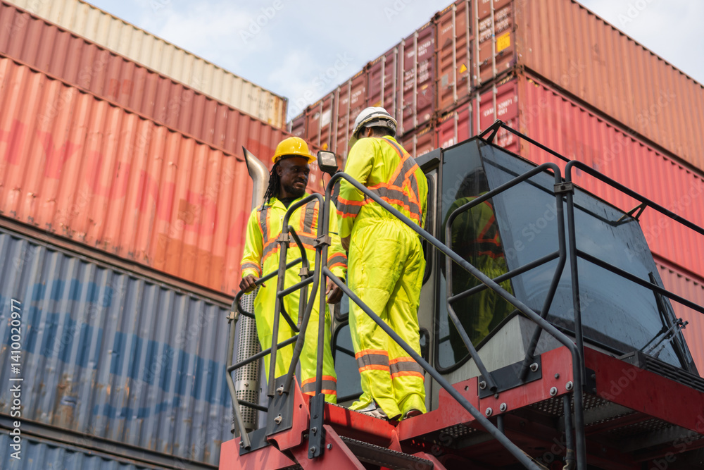 Supervisor in safety gear and engineer in hardhat checking and control loading containers box from shipping yard, Workers collaborating at shipping container cargo Supervisor in safety gear and engineer in hardhat checking and control loading containers box from shipping yard, Workers collaborating at shipping container cargo