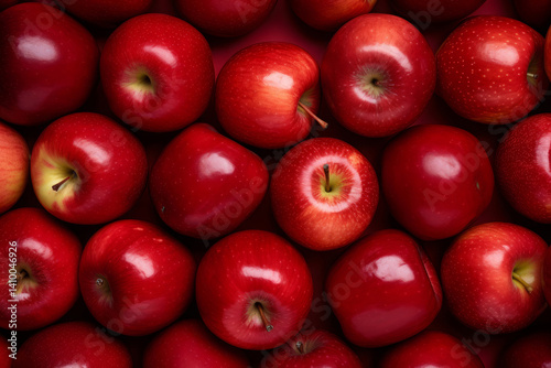 Fresh red apples filling the entire frame with droplets of water glistening, food background, overhead shot