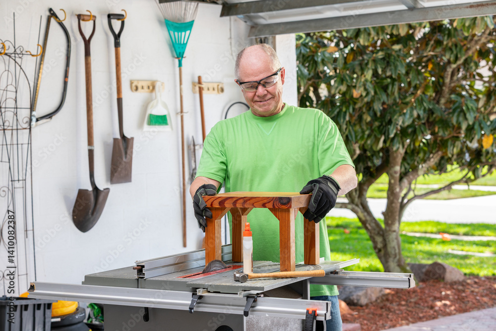 Senior man enjoys woodworking in his garage while admiring the successful completion of a project crafted with care. - series Senior man enjoys woodworking in his garage while admiring the successful completion of a project crafted with care. - series