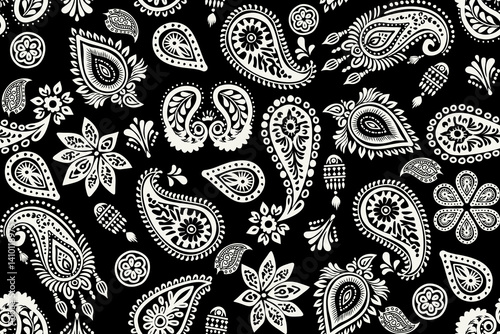 Seamless paisley floral pattern with vintage decorative design and retro textile style rendered in stark white against a deep black background. Design for fabrics, wallpapers