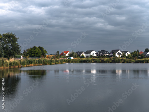 Obraz na płótnie Residential houses near the lake at Owińska village, Poznań County, Greater Poland, Wielkopolska w salonie