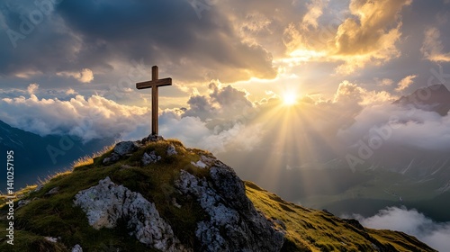 crucifix at the top of a mountain with sunlight breaking through the clouds inspirational christian image