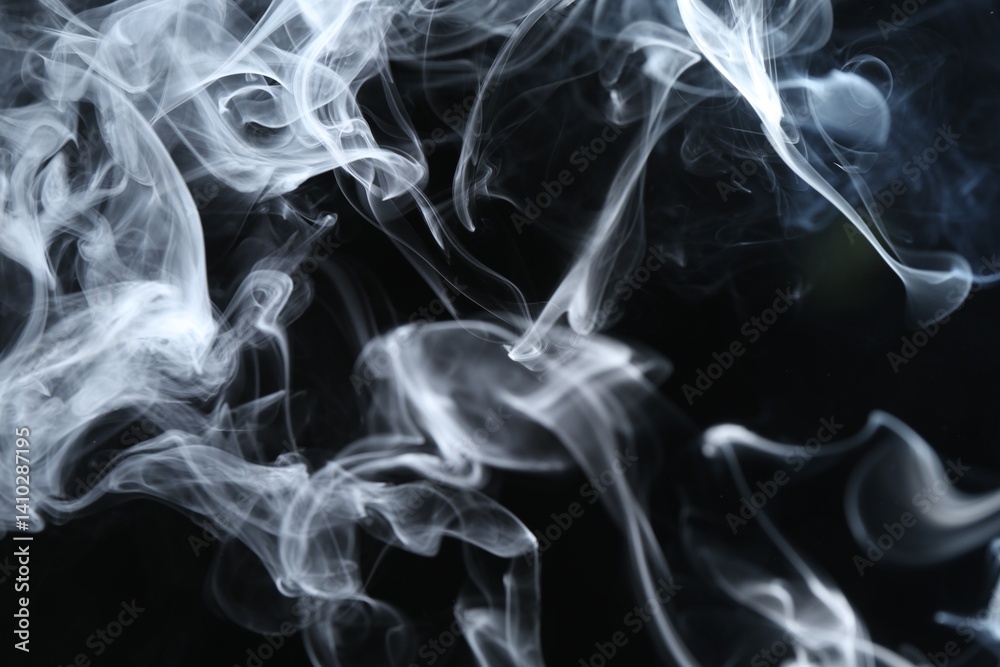 Fototapeta premium Beautiful white smoke flowing on dark background