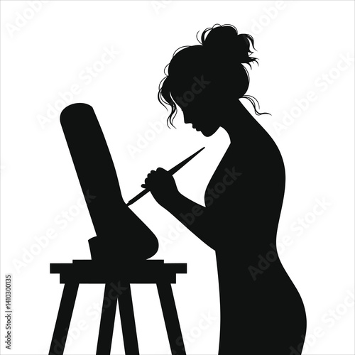 Black and White Silhouette of a Woman Painting/A striking silhouette of a woman painting at an easel.