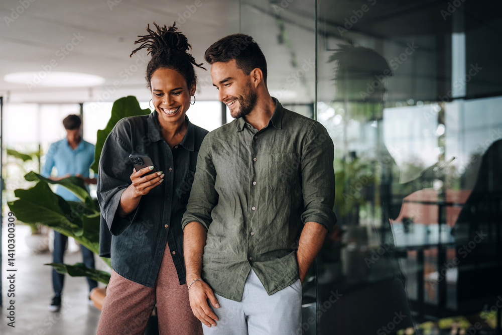 Group of young multi-ethnic startup business team collaborating on project in modern office