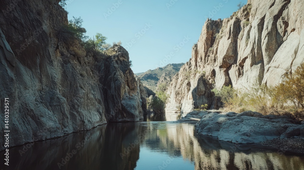 A canyon landscape with water reflecting the surrounding formations A canyon landscape with water reflecting the surrounding formations