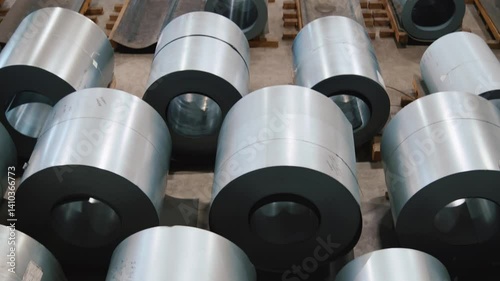 Steel coils stacked in a manufacturing facility showcasing industrial processes in action