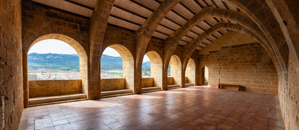 Large hall with stone arches in medieval style in the old town of Valderrobres, Teruel.