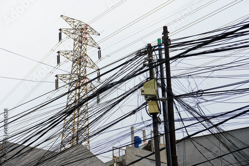 Power Lines and Electrical Tower with Chaotic Wire Arrangement Overhead