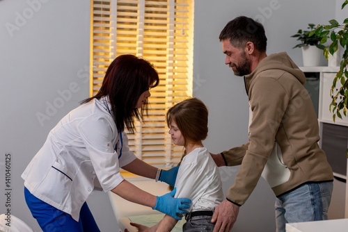 Obraz na płótnie Child Medical Care Alongside Parental Support Within a Modern Healthcare Clinic Environment w salonie