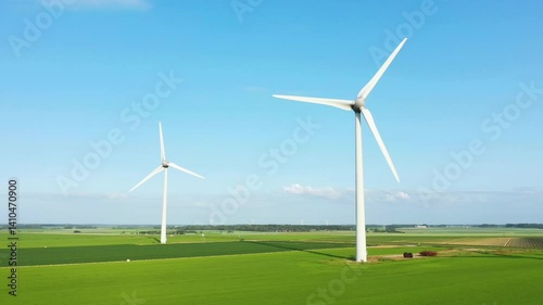 Wallpaper Mural Two Normandy wind turbines pierce the flax and barley fields, in Europe, in France, in Normandy, in Seine Maritime, near Fecamp, in summer, on a sunny day.  Torontodigital.ca