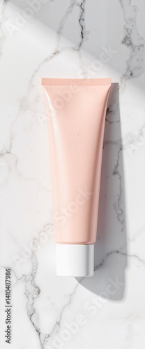 Elegant cosmetic tube mockup on marble surface, minimalistic design