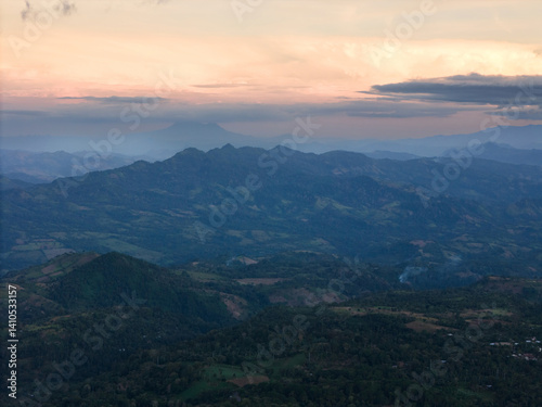 Obraz na płótnie Sunset over mountains and distant hills in serene, scenic view w salonie