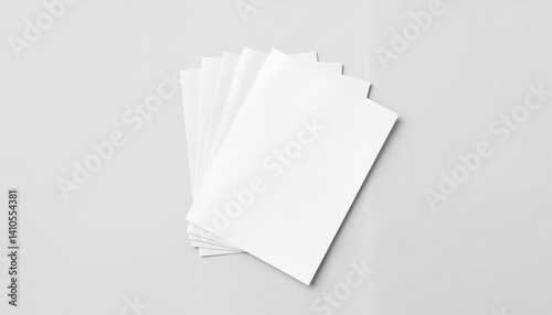 Minimalistic stack of blank white sheets on neutral surface, clean design