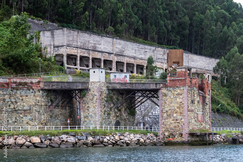 Old coal loaders and hoppers in the port of San Esteban de Pravia. Asturias, Spain