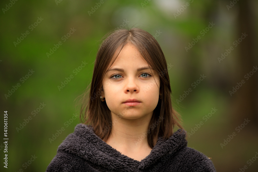 Portrait of preteen girl in park in spring
