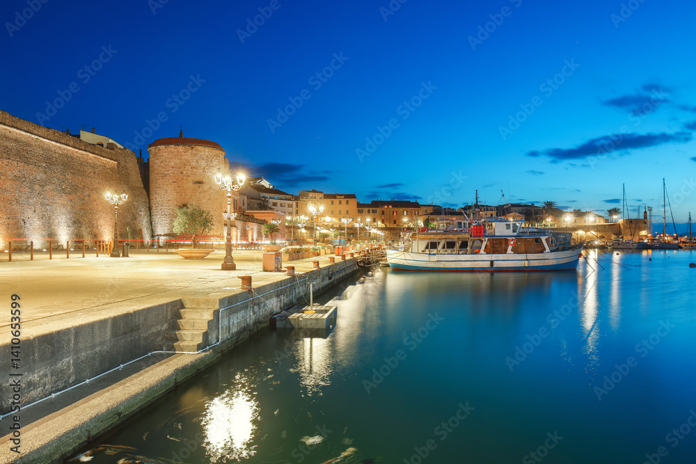 Unbelivable Night view of the Alghero Marina yacht port at the Gulf of Alghero with anchored sailboats