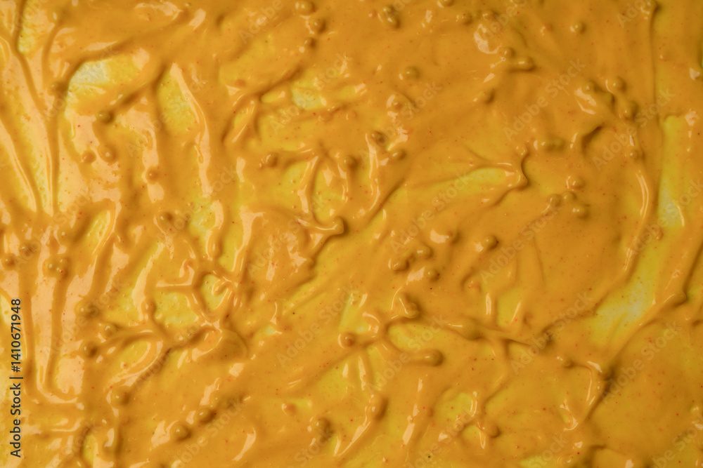 Obraz premium Yellow sauce splashes as a background.