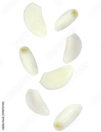 Levitating peeled garlic cloves isolated on transparent background. Fresh, aromatic and dynamic composition with floating elements.
