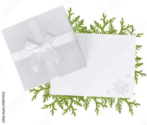 Gift box with open greeting card and blank space for text, decorated with fir tree branch, isolated on transparent background. Festive and minimal composition.