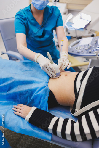 Obraz na płótnie Shot of a pregnant woman during an ultrasound scan in a fertility clinic. Examination healthcare pregnancy gynecology people professionalism trust w salonie