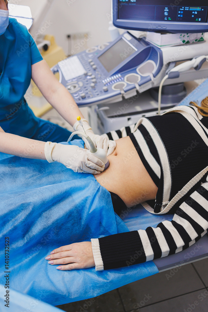 Woman lying near doctor during pregnancy ultrasound. Checking pregnant woman during pregnancy disturbance