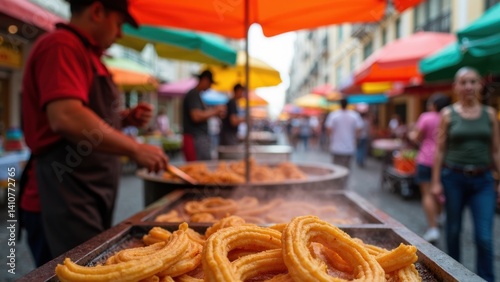 Obraz na płótnie A street vendor prepares fresh churros, with golden dough sizzling in hot oil. Colorful umbrellas add vibrancy to the lively market atmosphere. w salonie
