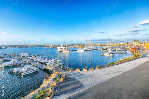 Obraz na płótnie Unbelivable summer view of the Alghero Marina yacht port at the Gulf of Alghero with anchored sailboats. w salonie