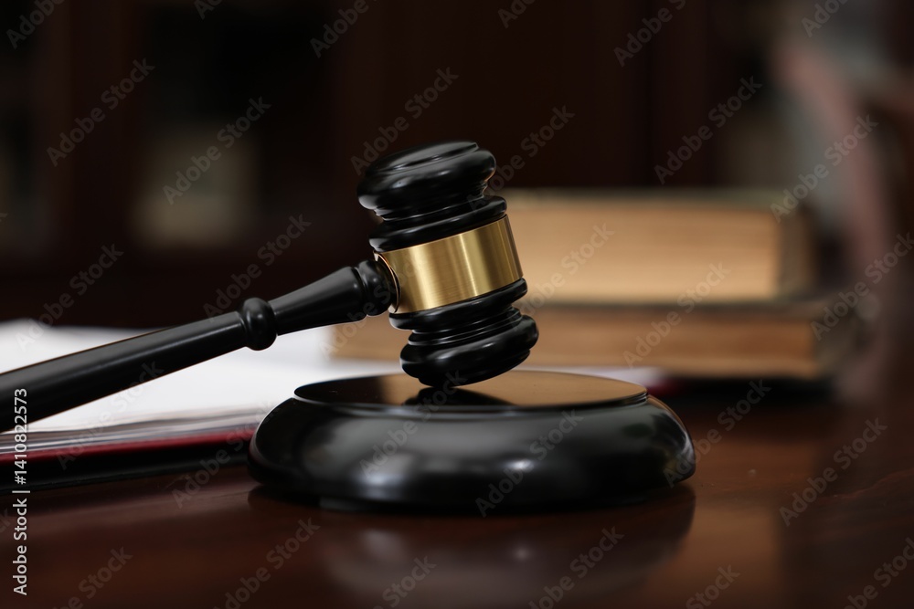 Judge workplace with gavel and books indoors, closeup Judge workplace with gavel and books indoors, closeup
