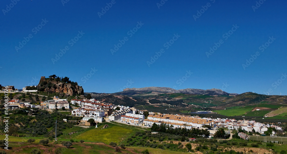 Fototapeta premium Panoramic view of Pruna village with its castle dominating the landscape in Andalusia, Spain