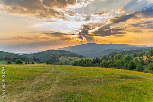 Beautiful sunset over the countryside of Podpolanie, Slovakia, picturesque landscape. Spring, gardening, agriculture concept. Nature background, Europe