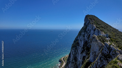 Rock of Gibraltar overlooking the sea under blue sky