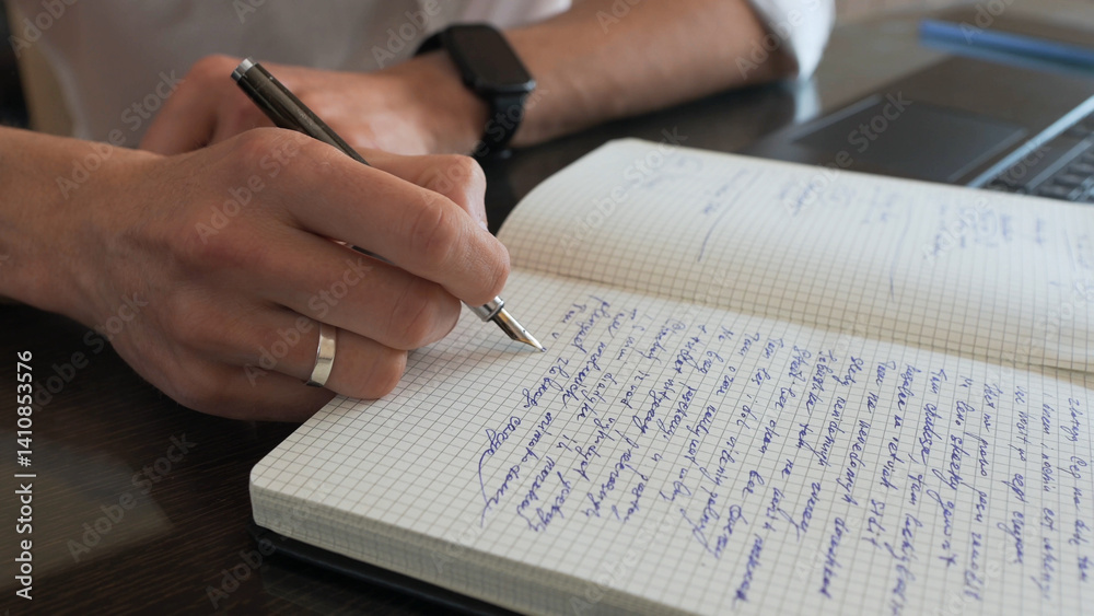 Naklejka premium Professional Writer Taking Notes in a Journal at Workplace Desk