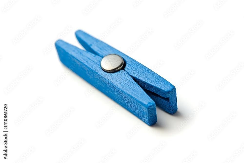 A small blue wooden clothespin with a metallic center, isolated on a white background for a simple yet charming detail.