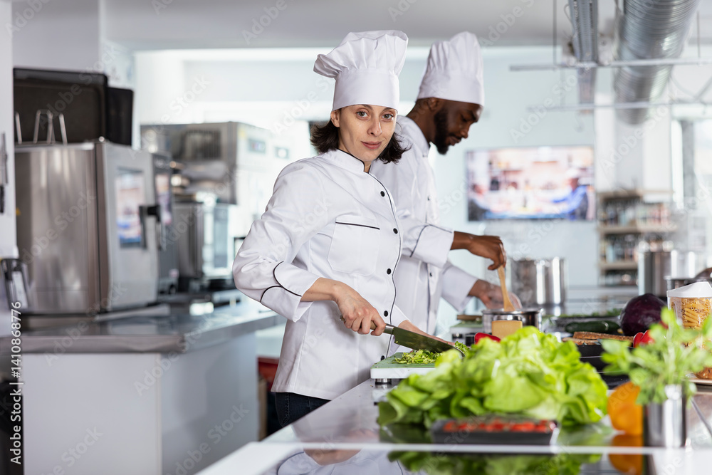 Chef chopping vegetables on a cutting board and preparing ingredients in a modern commercial kitchen. Woman cooking flavorful recipes and fine dining gourmet dishes, chef life. Chef chopping vegetables on a cutting board and preparing ingredients in a modern commercial kitchen. Woman cooking flavorful recipes and fine dining gourmet dishes, chef life.