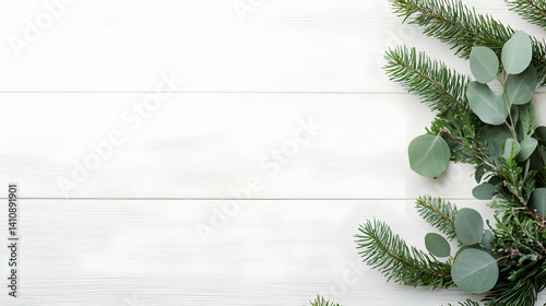Festive Arrangement Of Green Branches And Leaves On White Wooden Background